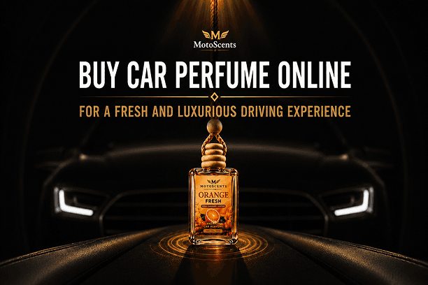 Bottle of MotoScents Orange Fresh car perfume hanging in front of a dark car with bold text promoting online purchase.