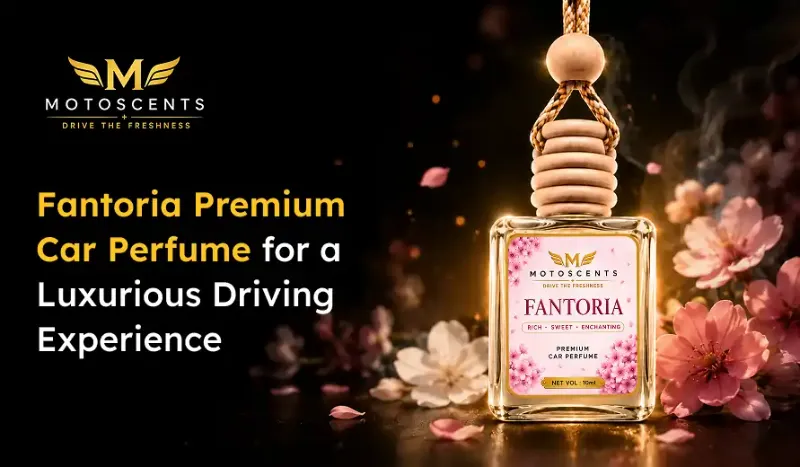 Bottle of Fantoria Premium Car Perfume by Motoscents with floral background, promoting a luxurious driving experience.